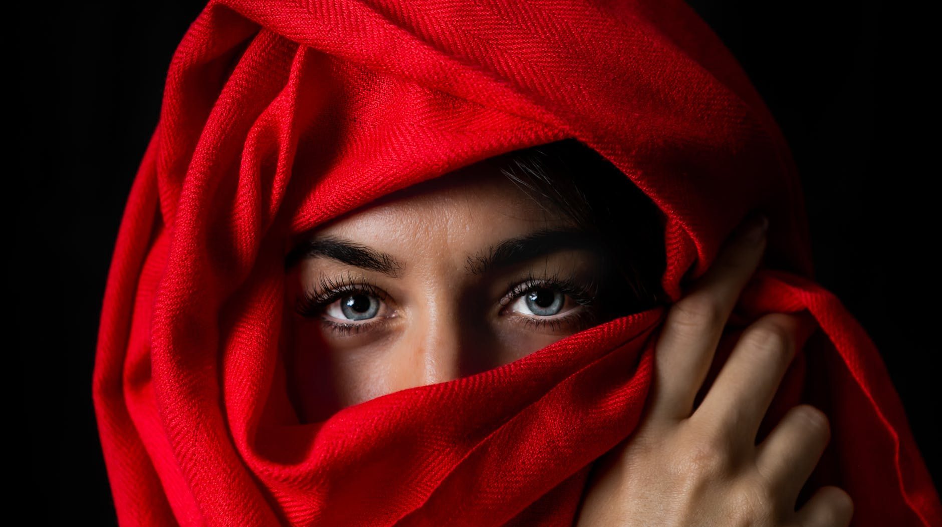 photo of person covered by red headscarf